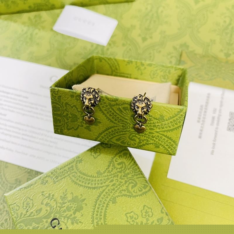 G*u*i earrings